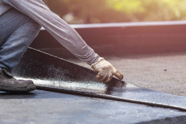 Professional Basement Waterproofing technician working in Piedmont, AL